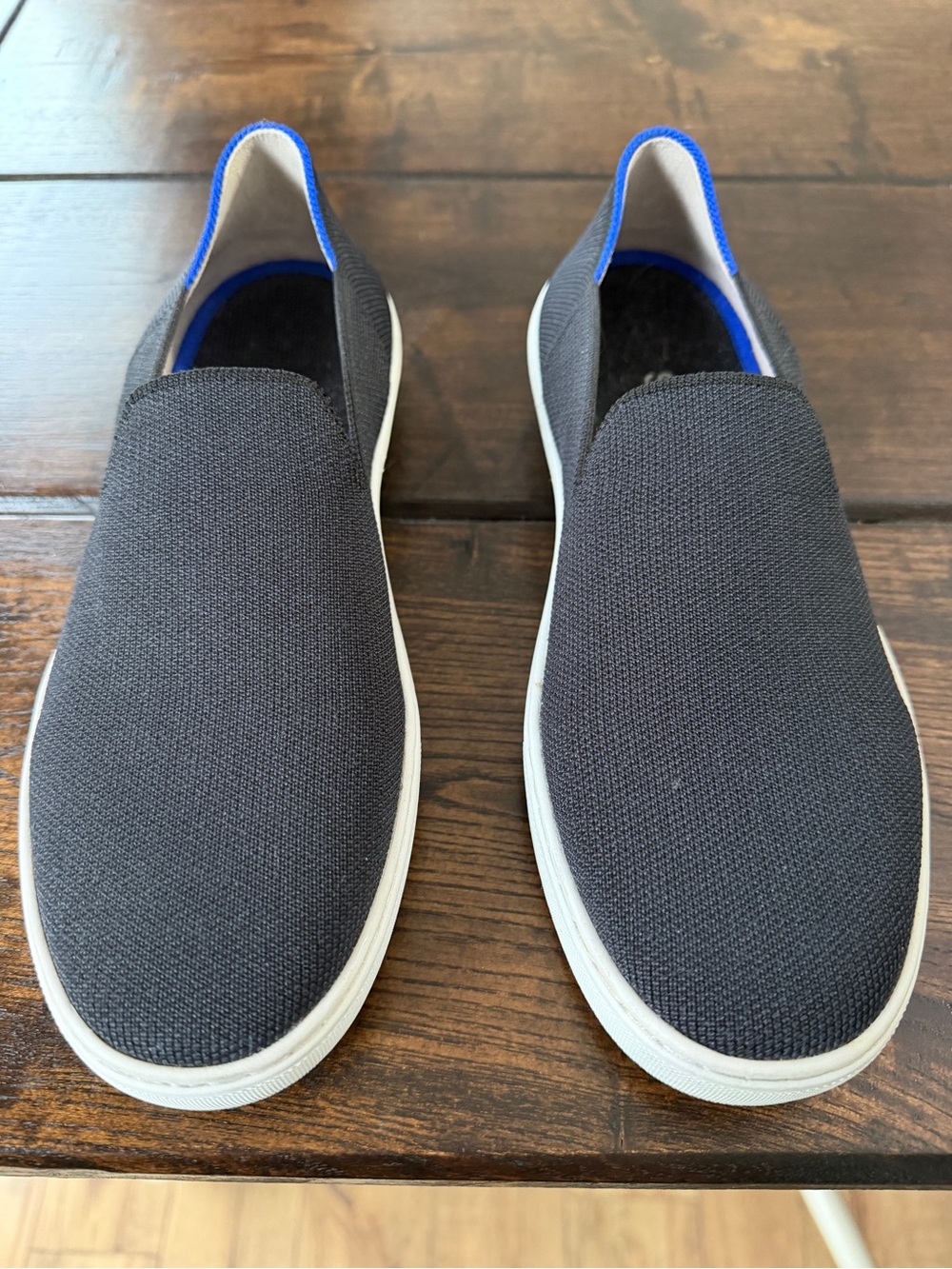 Rothy's Women's Slip-On Sneakers in Black with Blue Trim